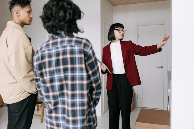 A real estate agent doing a presentation to a couple